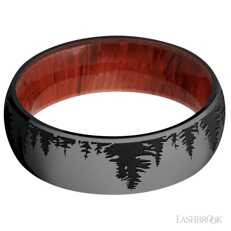 7 mm wide/Domed/Zirconium band with a laser carved Trees pattern also featuring a Padauk sleeve.